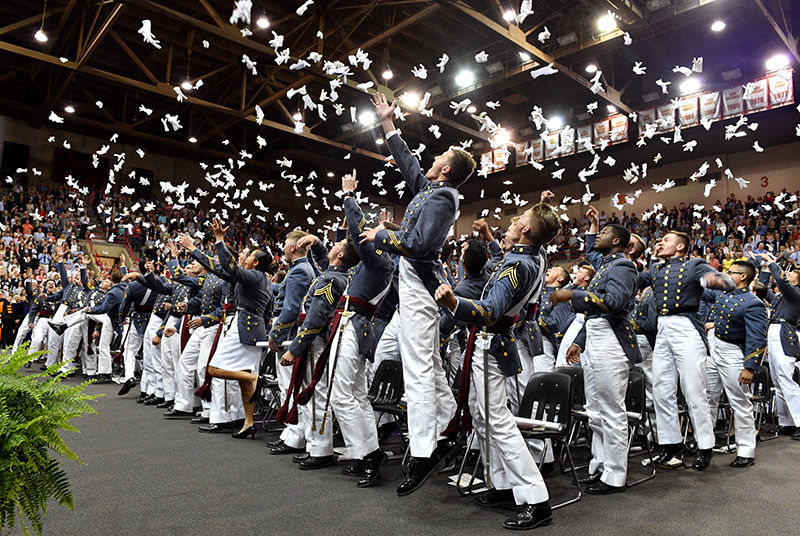 Cadets toss their gloves in the air after being declared graduates of VMI.